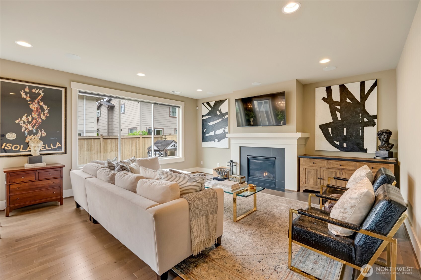 619 Graham Avenue Northeast Renton, WA 98059 - Photo 12 of 40 a living room with furniture a flat screen tv and a fireplace