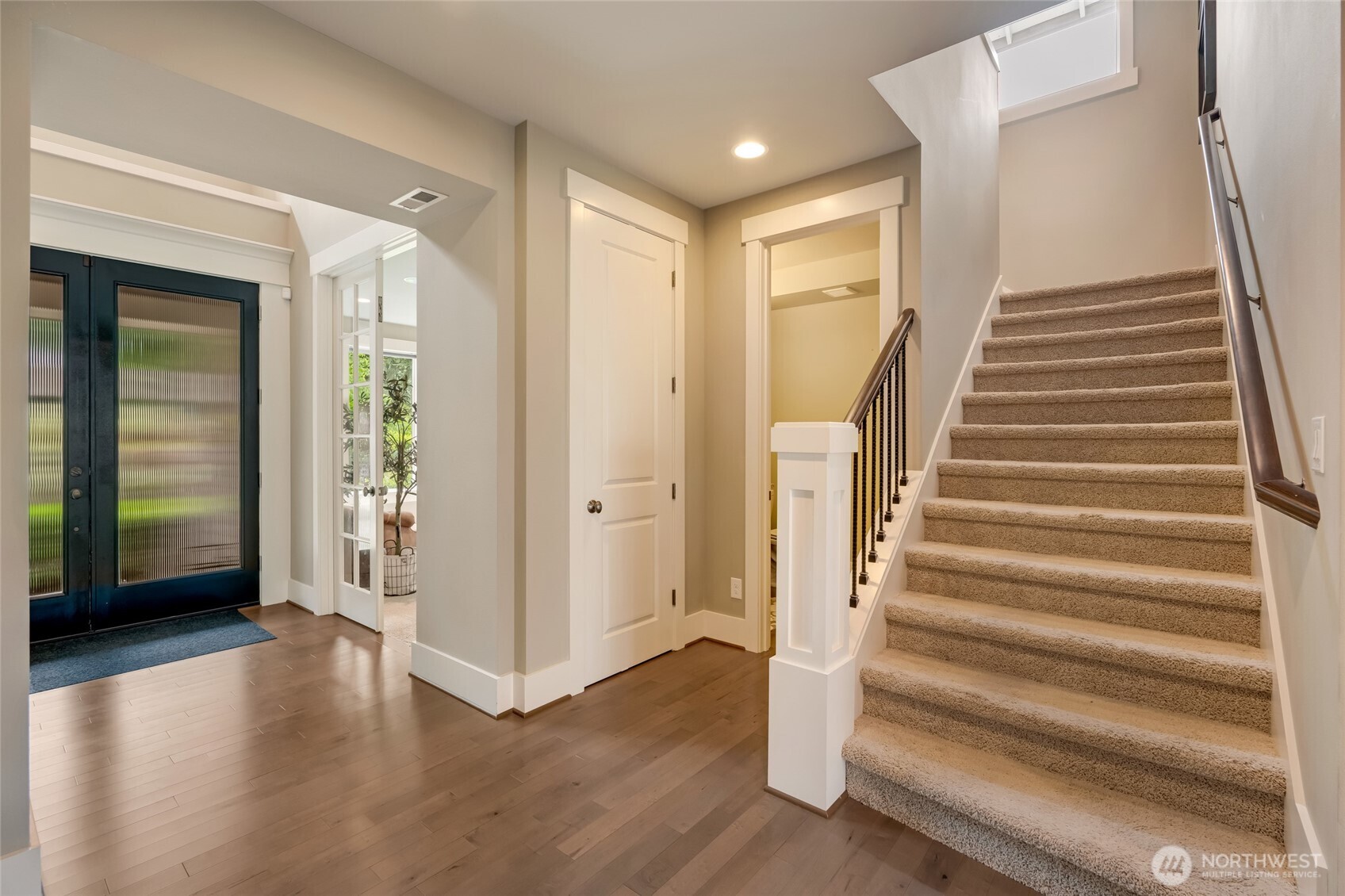 619 Graham Avenue Northeast Renton, WA 98059 - Photo 20 of 40 a view of an entryway with wooden floor and stairs