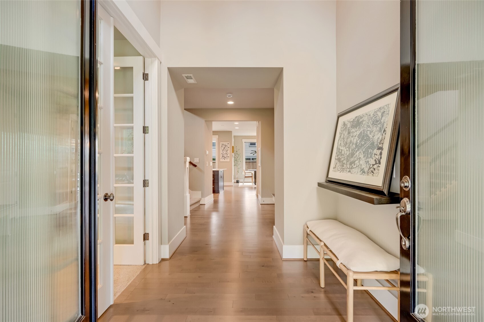 619 Graham Avenue Northeast Renton, WA 98059 - Photo 2 of 40 a view of a hallway with wooden floor and staircase