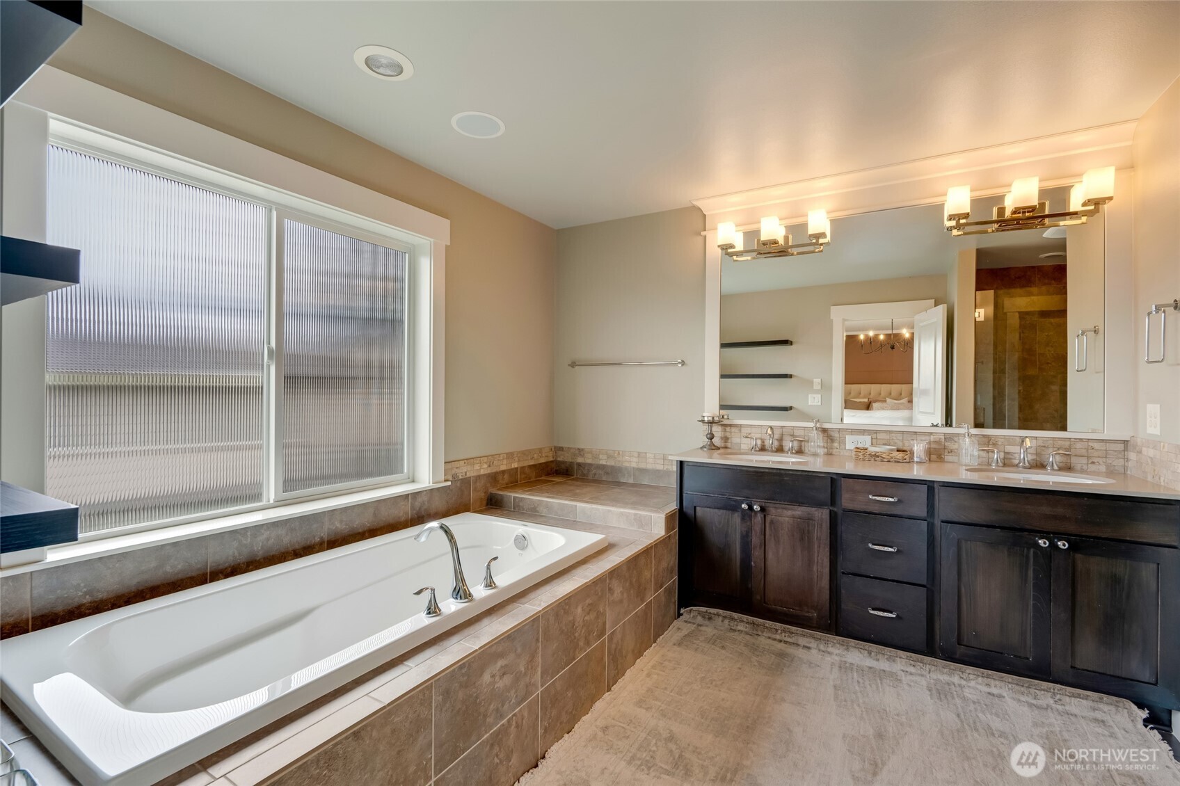619 Graham Avenue Northeast Renton, WA 98059 - Photo 26 of 40 a bathroom with a bathtub and double sink