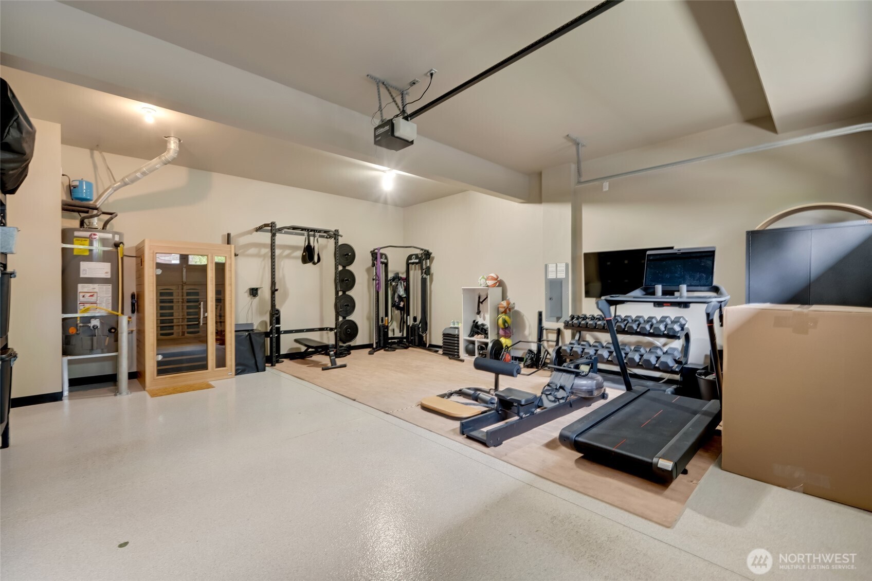 619 Graham Avenue Northeast Renton, WA 98059 - Photo 35 of 40 a room with gym equipment and a large window