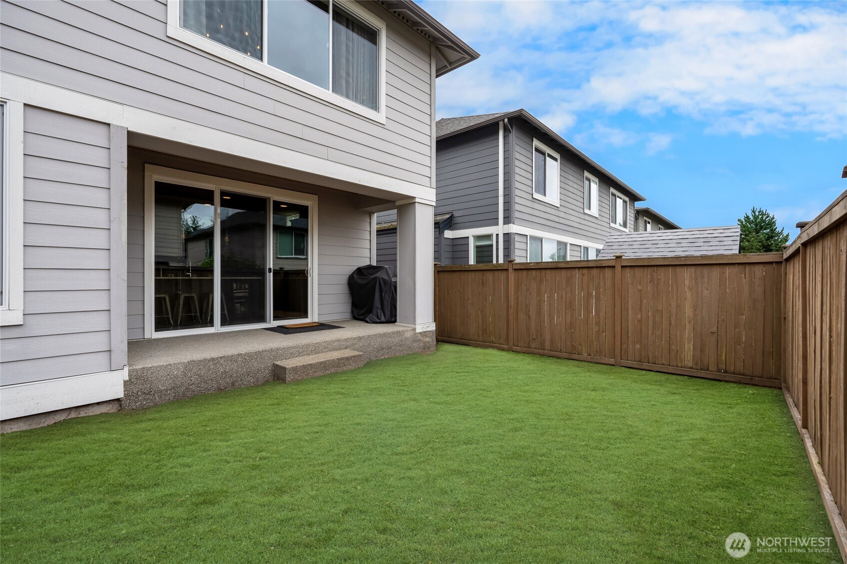 619 Graham Avenue Northeast Renton, WA 98059 - Photo 39 of 40 a view of a house with a yard