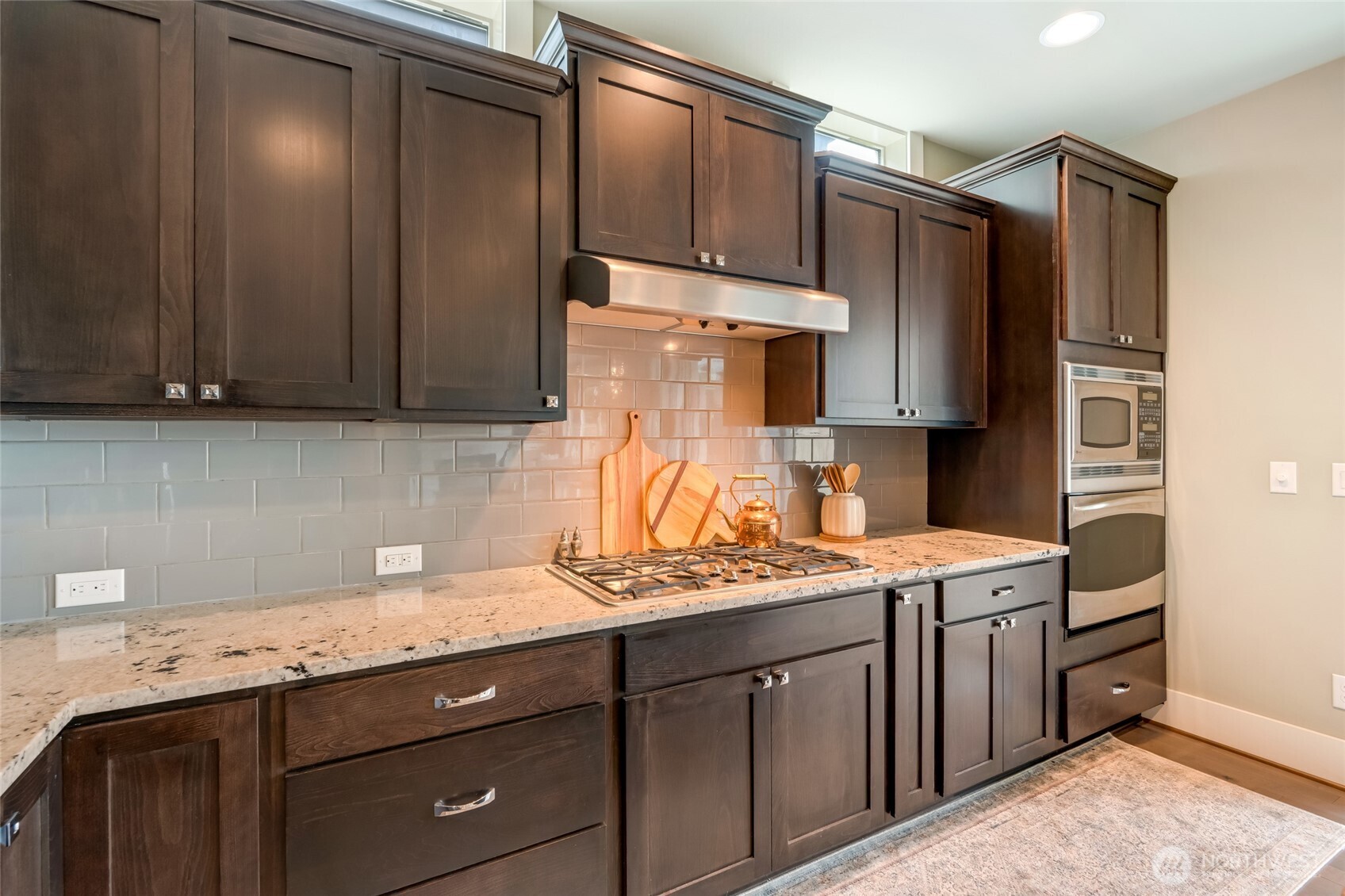 619 Graham Avenue Northeast Renton, WA 98059 - Photo 6 of 40 a kitchen with stainless steel appliances granite countertop a refrigerator stove and sink