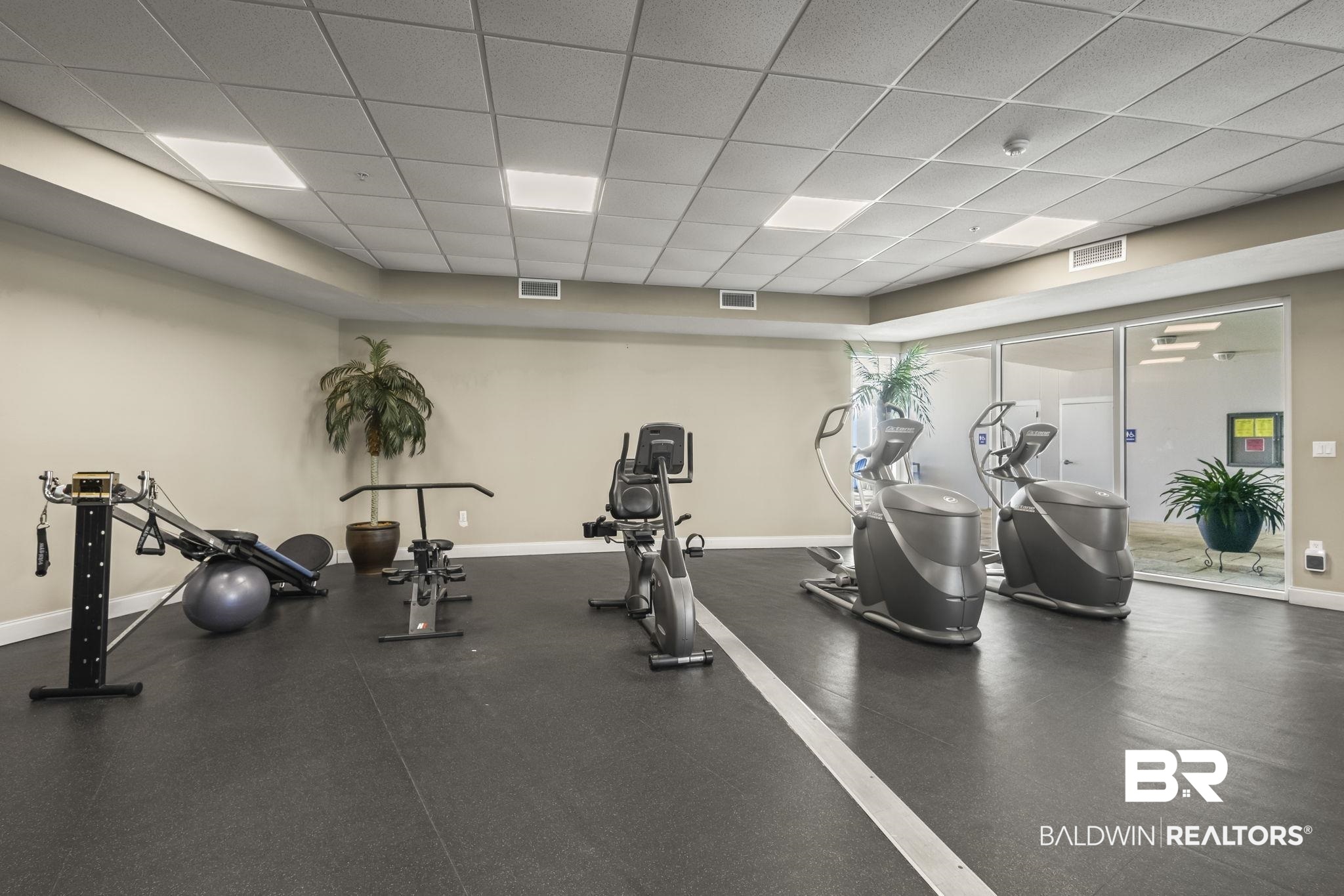 27800 Canal Road, Unit 313 Orange Beach, AL 36561 - Photo 20 of 23 Gym featuring a paneled ceiling