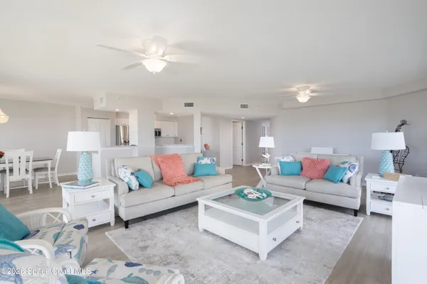 a living room with furniture and white walls