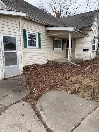 a front view of a house with parking space