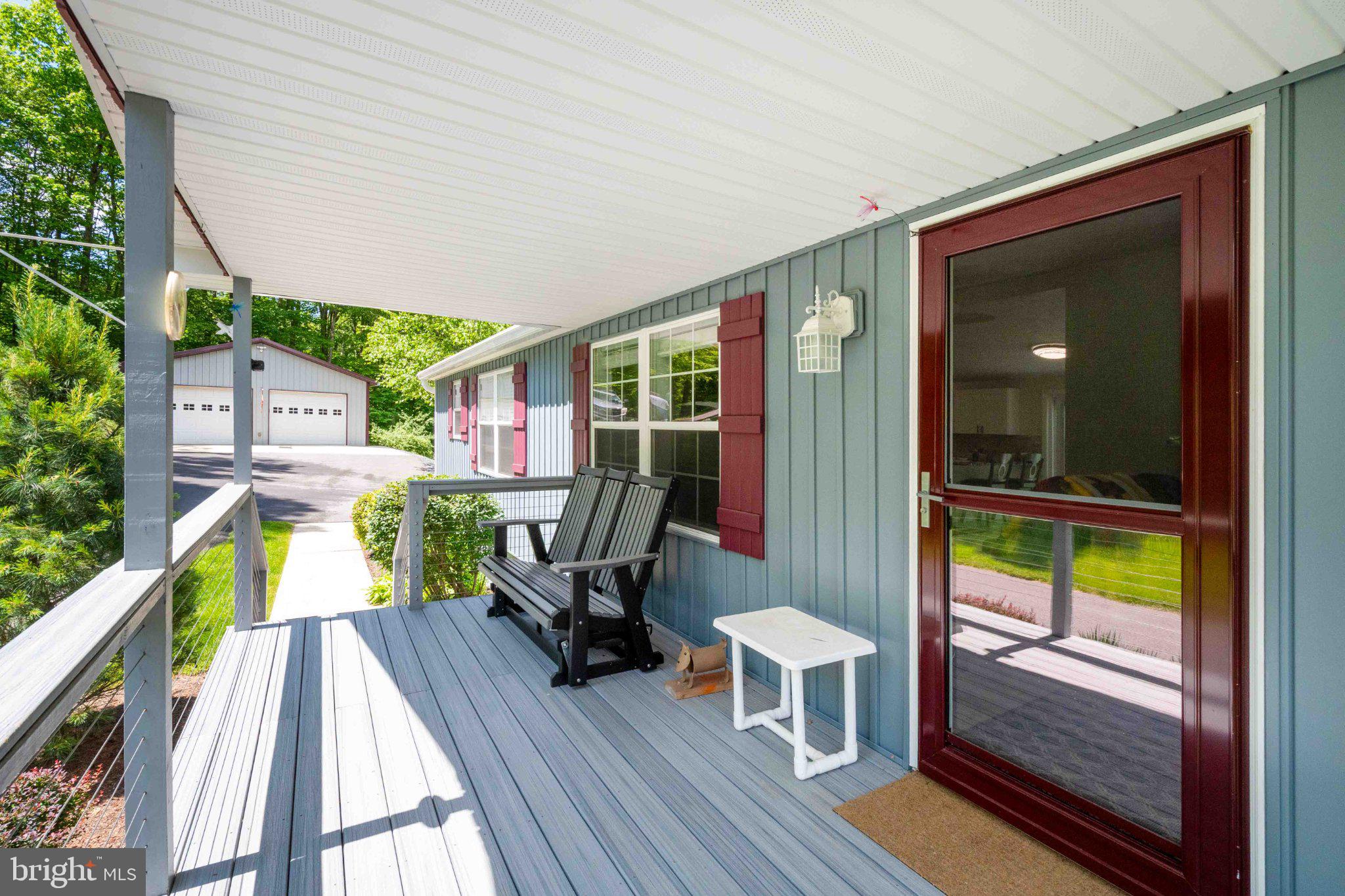 511 Hill Top Road Oakland, MD 21550 - Photo 4 of 51 Charming porch with serene views.