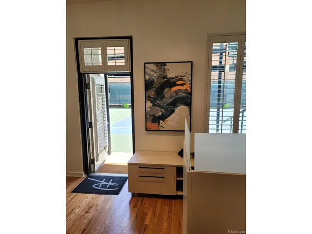a view of a livingroom with furniture and wooden floor