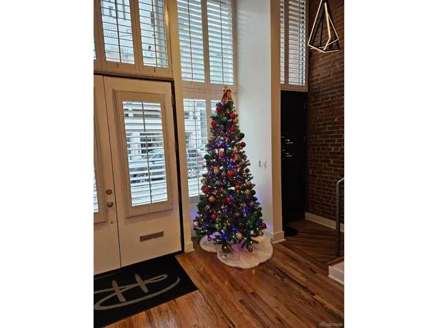 a view of an entryway with wooden floor