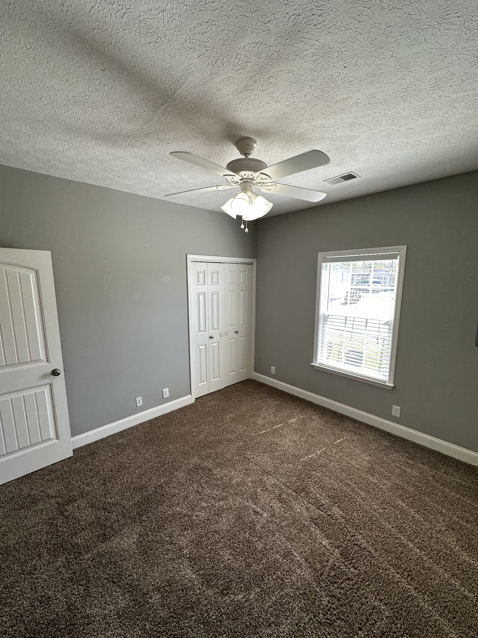 583 Neelys Bend Road Madison, TN 37115 - Photo 16 of 21 an empty room with windows and fan
