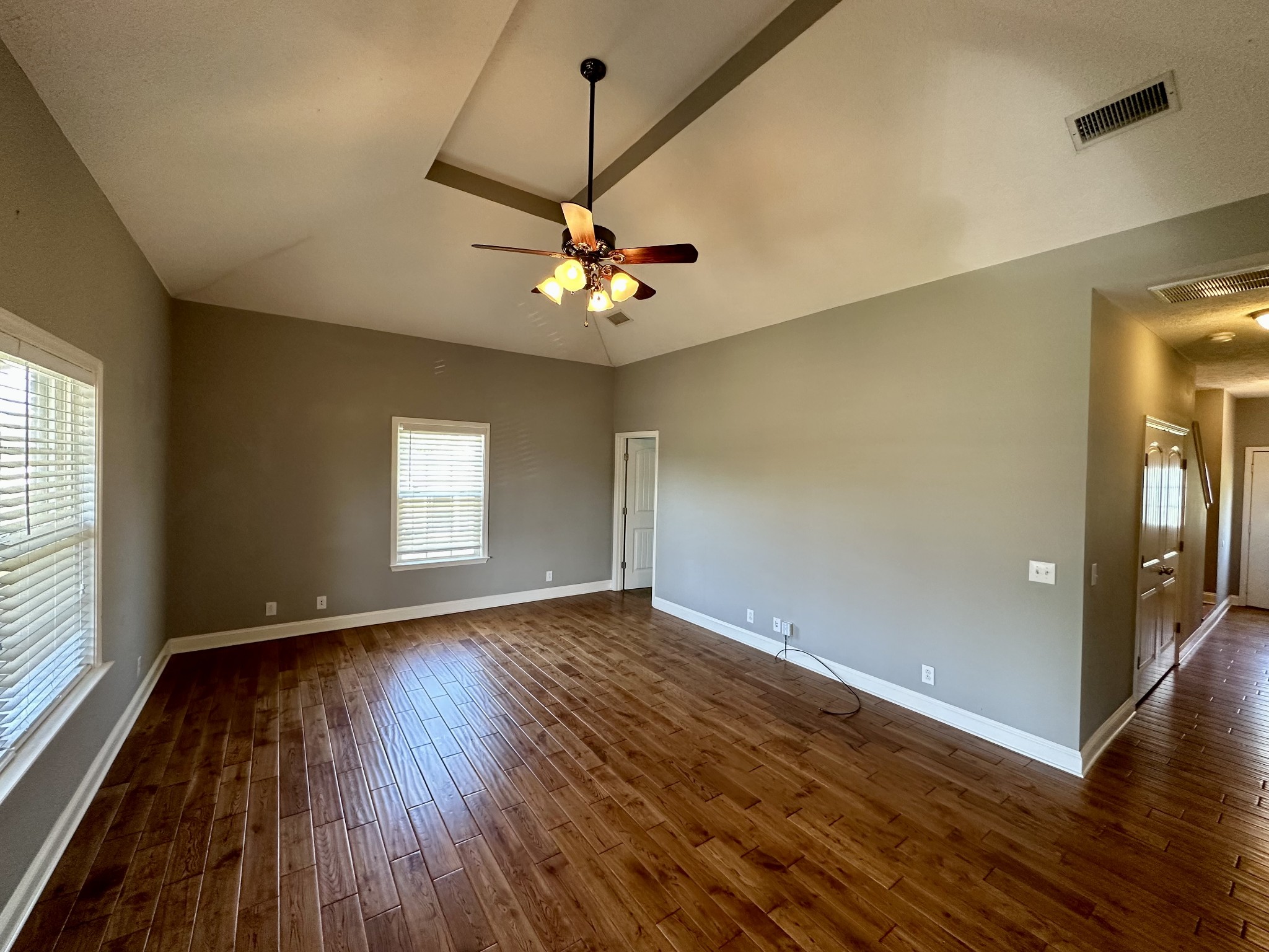 583 Neelys Bend Road Madison, TN 37115 - Photo 5 of 21 an empty room with wooden floor and windows