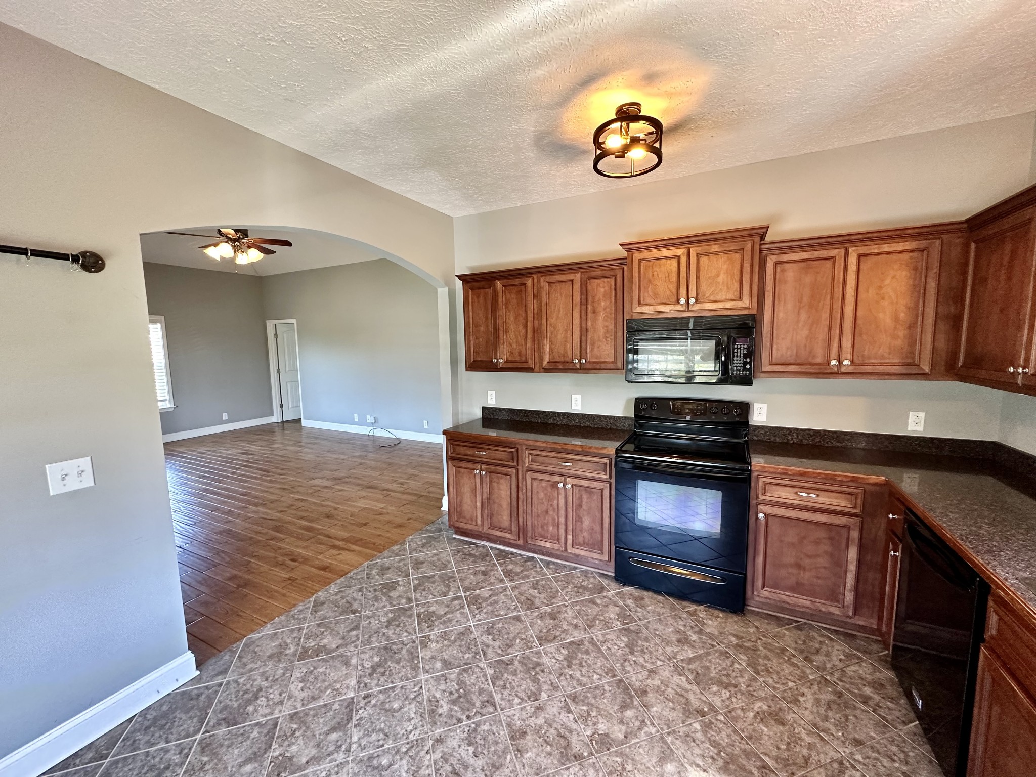583 Neelys Bend Road Madison, TN 37115 - Photo 7 of 21 a kitchen with a stove a sink and a microwave