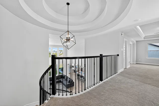 a view of a hallway with a chandelier