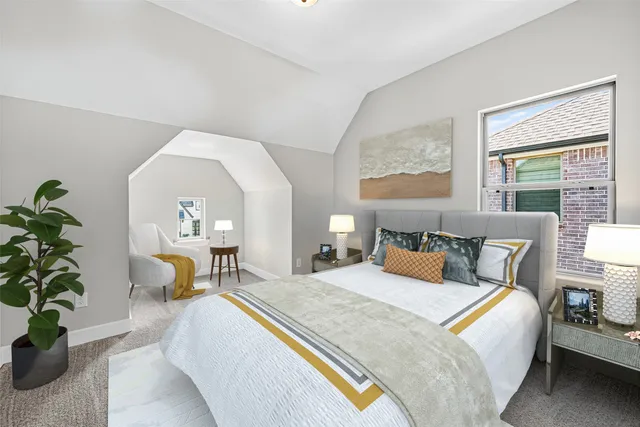 a bedroom with bed and a couch