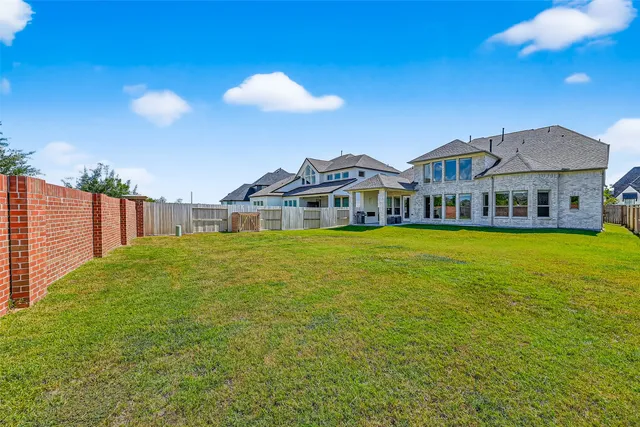 a view of a house with a big yard