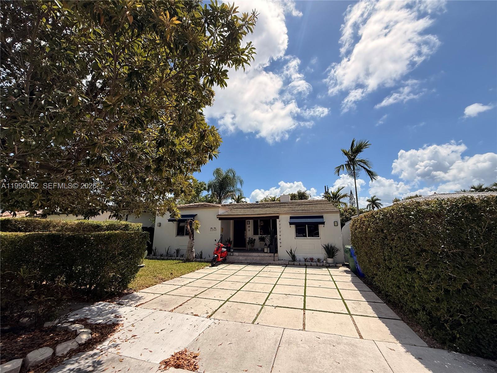 2260 Southwest 25th Street Miami, FL 33133 - Photo 2 of 5 a view of a house with backyard and garden