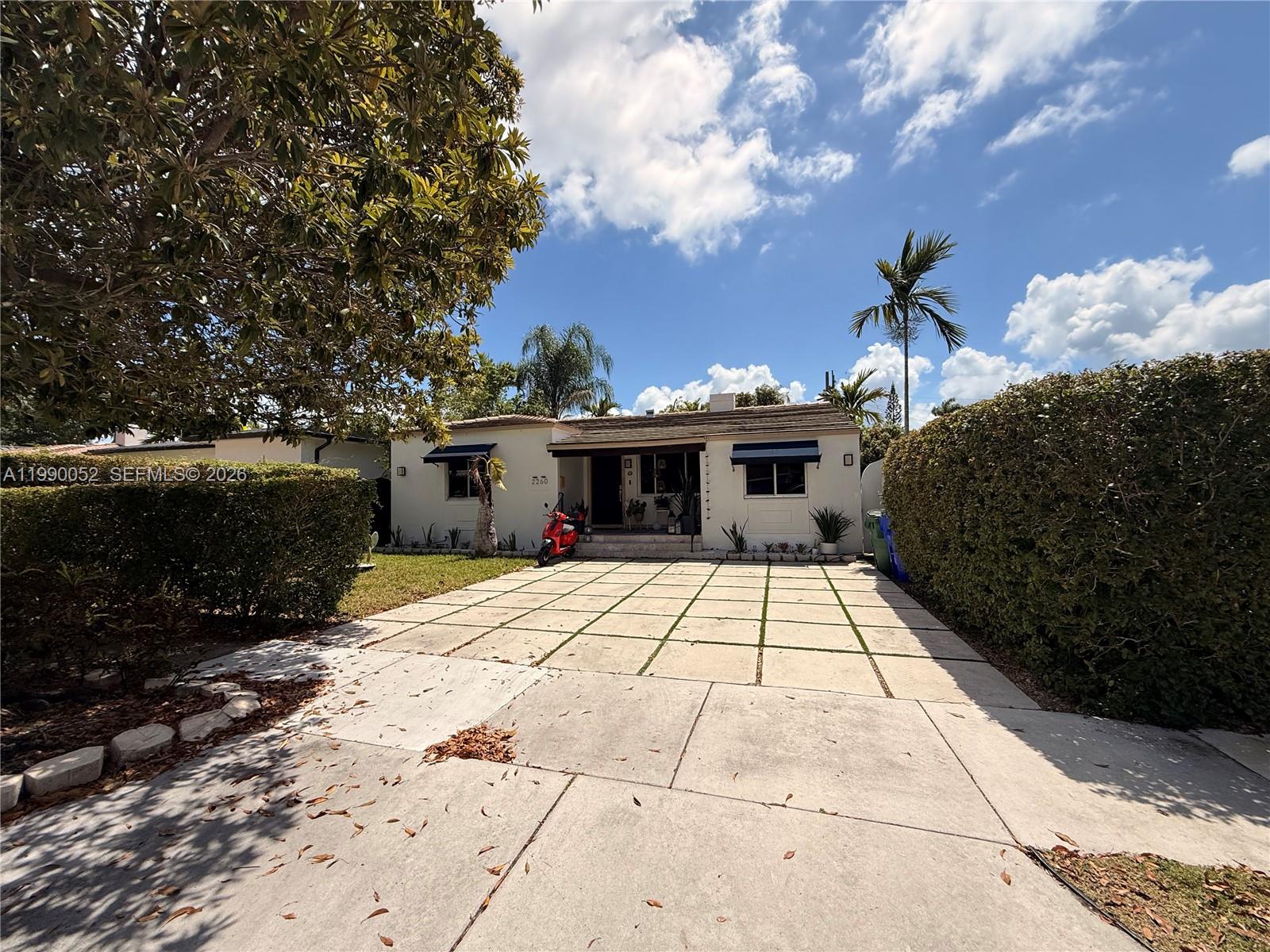 2260 Southwest 25th Street Miami, FL 33133 - Photo 4 of 5 a front view of a house with a yard