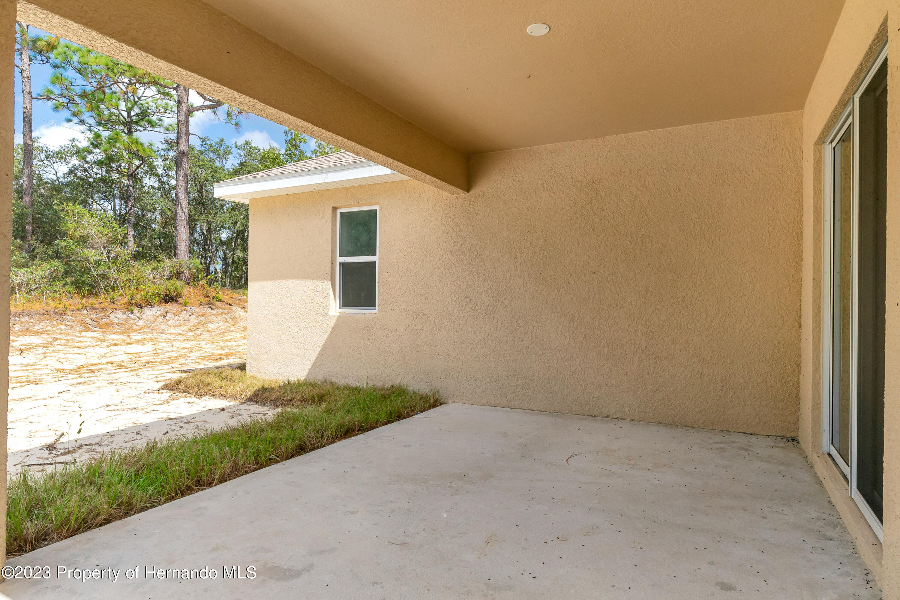 8433 Nightingale Road Weeki Wachee, FL 34613 - Photo 23 of 23 a view of house with backyard and garden