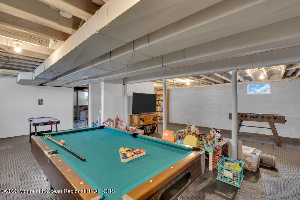 210 Richdale Road Colts Neck, NJ 07722 - Photo 31 of 40 a room with furniture pool table table and chairs