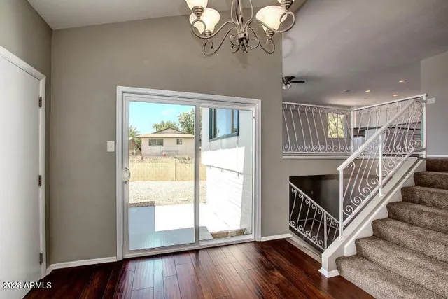 a view of entryway with wooden floor