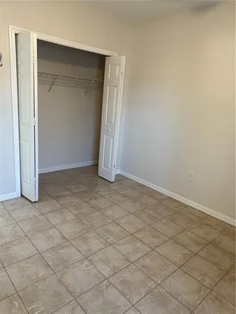 an empty room with a bench