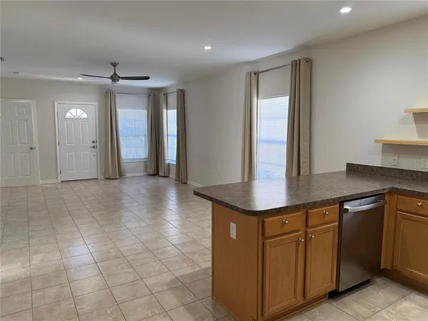 a kitchen with stainless steel appliances granite countertop a sink and a granite counter tops
