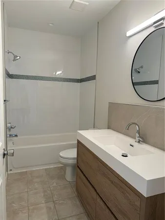 a bathroom with a sink a toilet and a bathtub