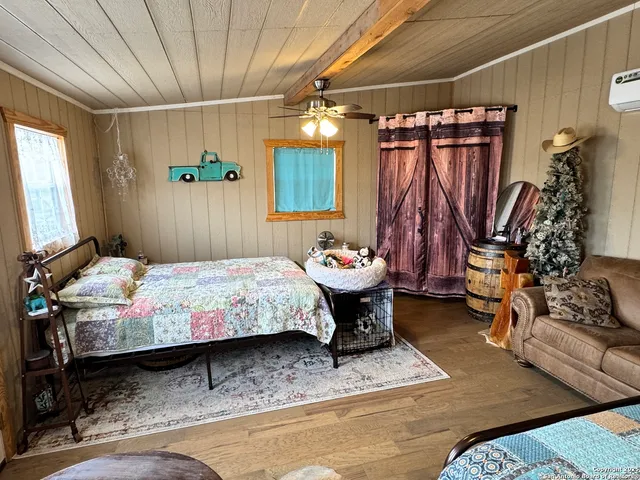 a bedroom with a bed and a mirror