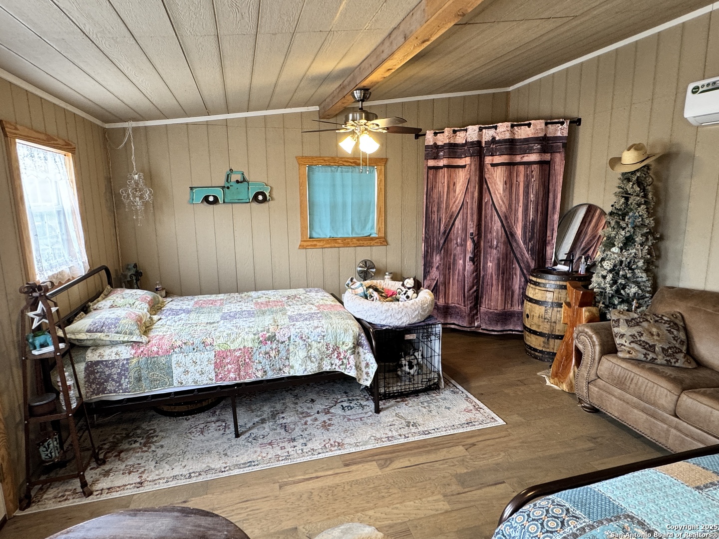 1616 Middle Road George West, TX 78022 - Photo 3 of 14 a bedroom with a bed and a mirror