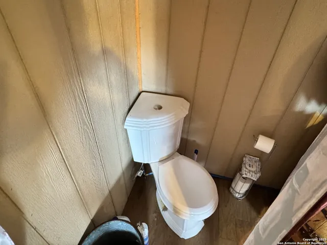a bathroom with a toilet and a sink