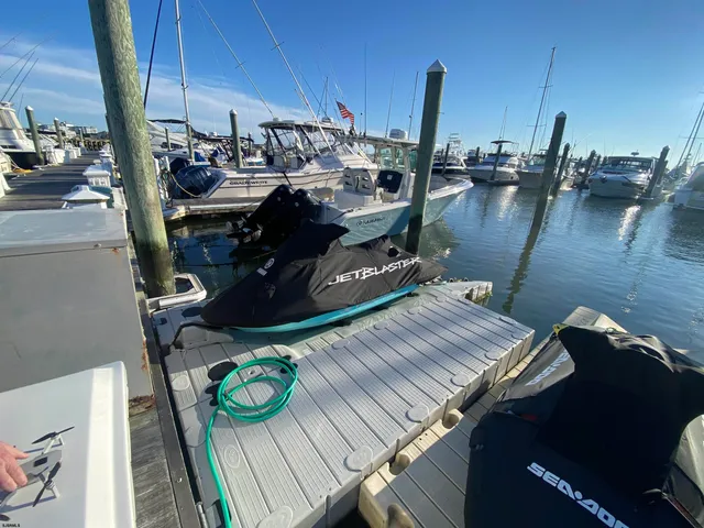 a view of roof deck with two chair and city view