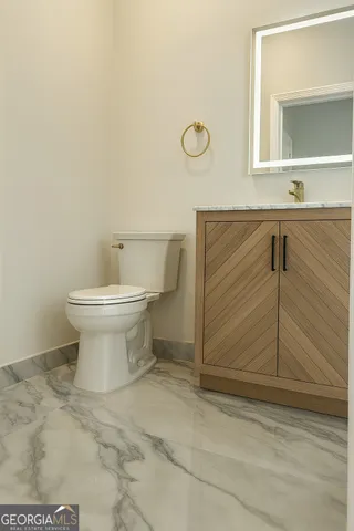 a bathroom with a toilet and a sink
