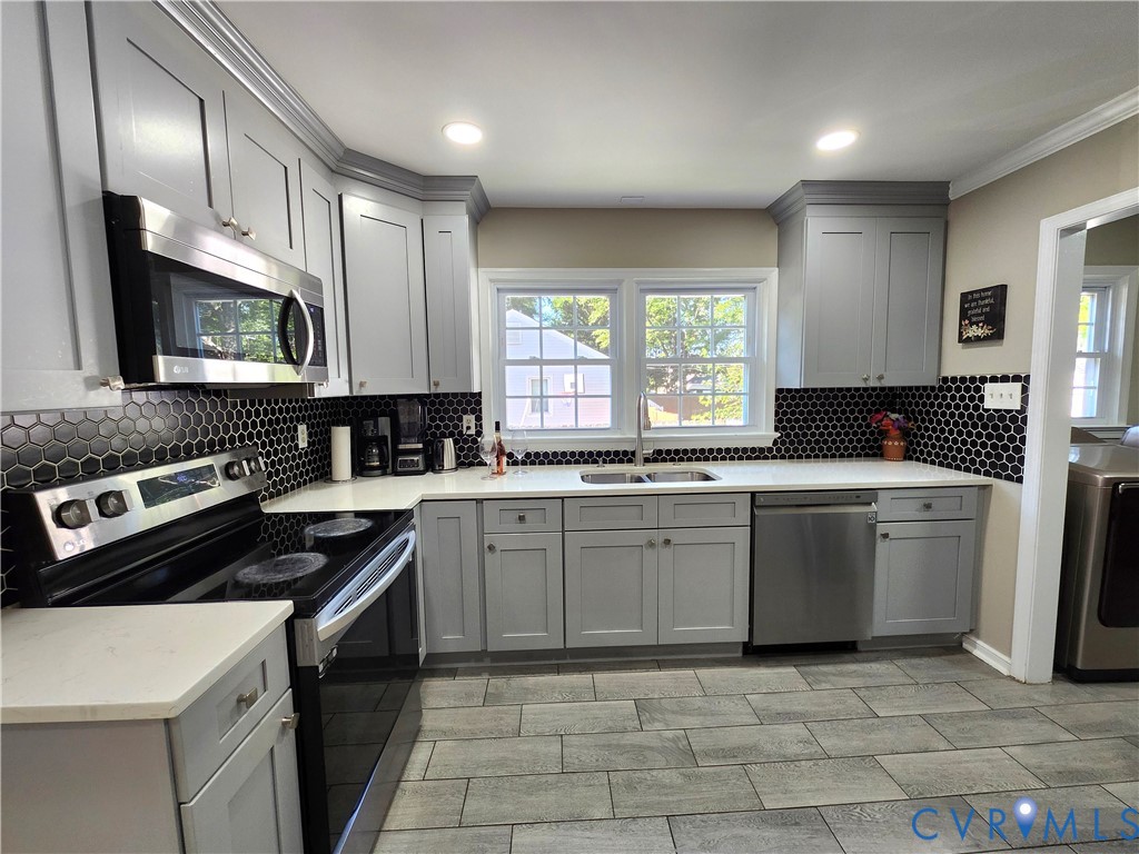 2718 Stacie Road Richmond, VA 23224 - Photo 11 of 50 Kitchen featuring light gray cabinetry, white coun