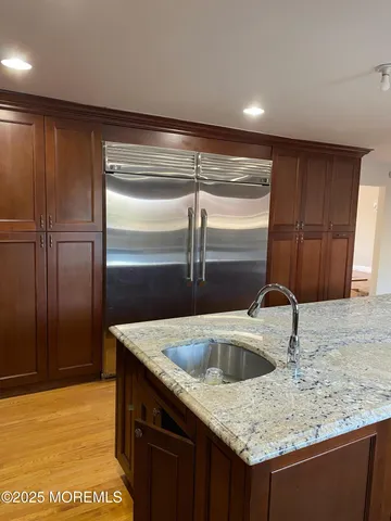 a kitchen with a sink and cabinets