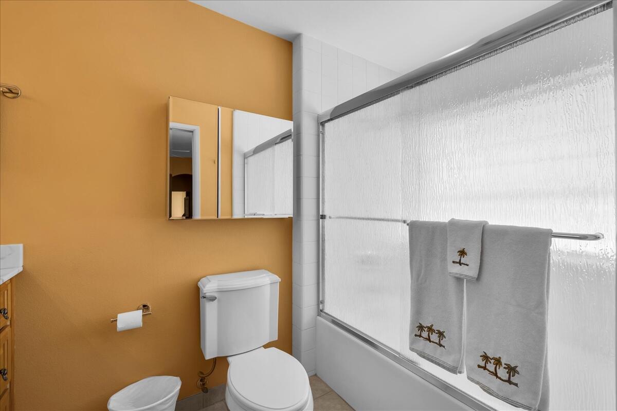 1555 North Chaparral Road, Unit 323 Palm Springs, CA 92262 - Photo 18 of 29 a bathroom with a toilet a sink and mirror