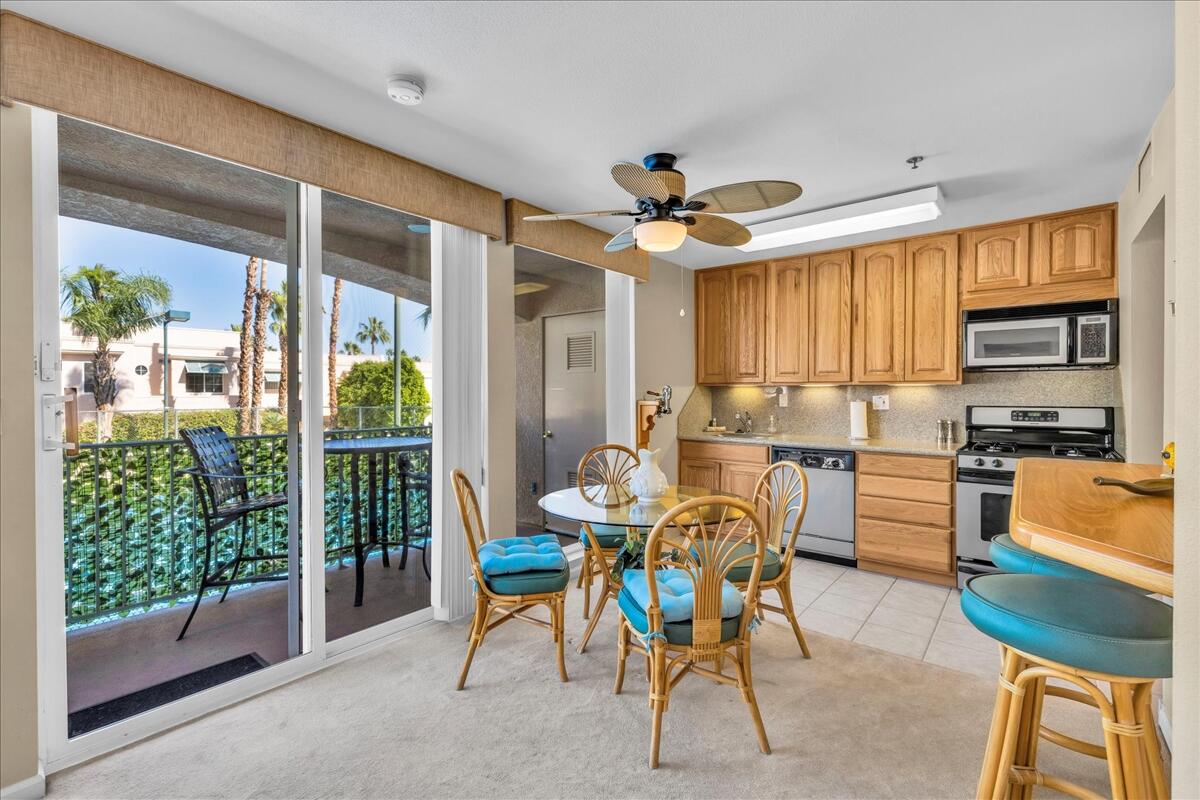 1555 North Chaparral Road, Unit 323 Palm Springs, CA 92262 - Photo 2 of 29 a view of a dining room with furniture window and outside view