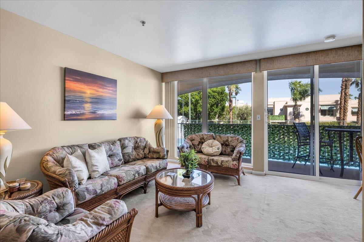 1555 North Chaparral Road, Unit 323 Palm Springs, CA 92262 - Photo 6 of 29 a living room with furniture and a large window