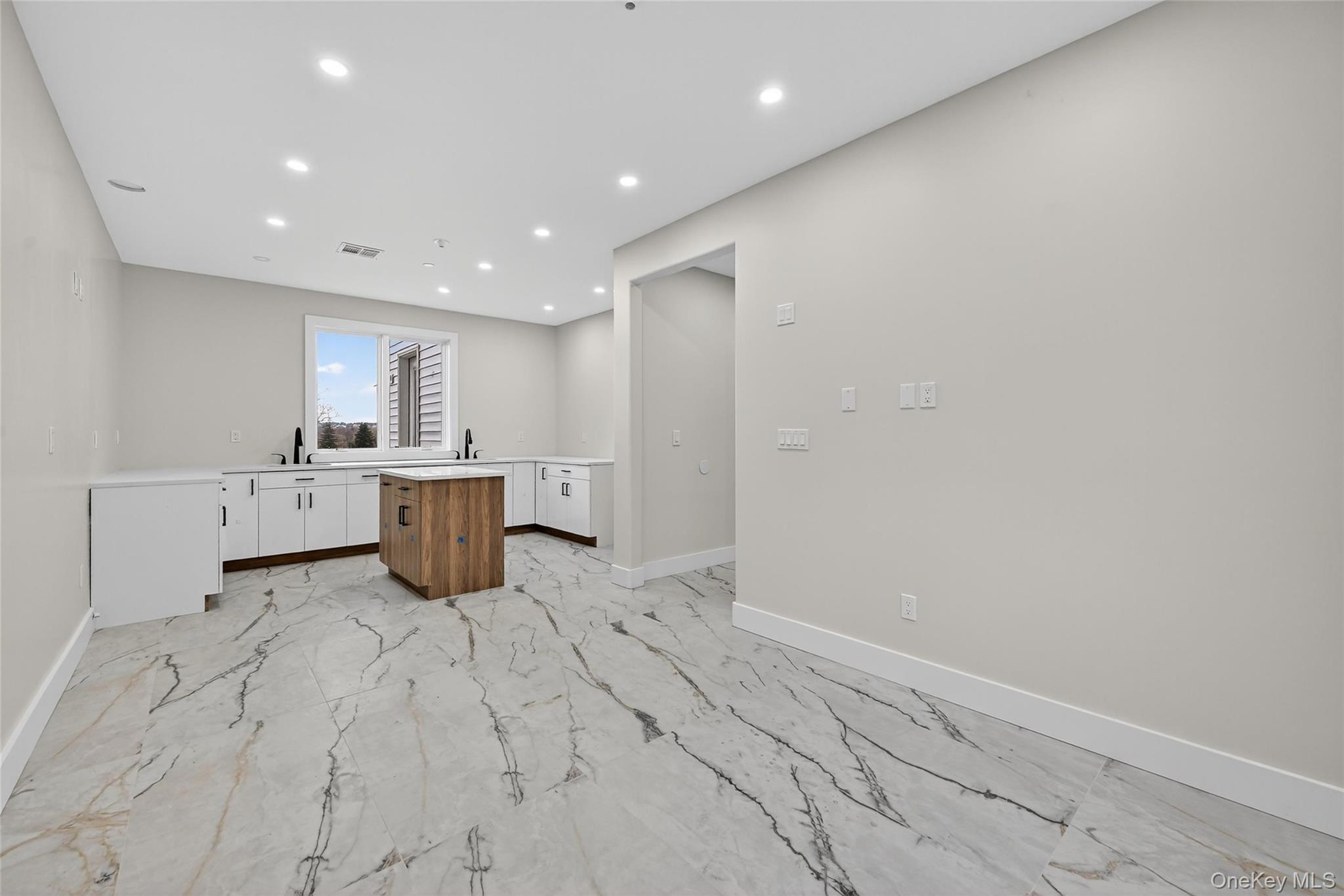 6 Milla Lane Spring Valley, NY 10977 - Photo 11 of 49 a large white kitchen with a sink dishwasher stove and cabinets