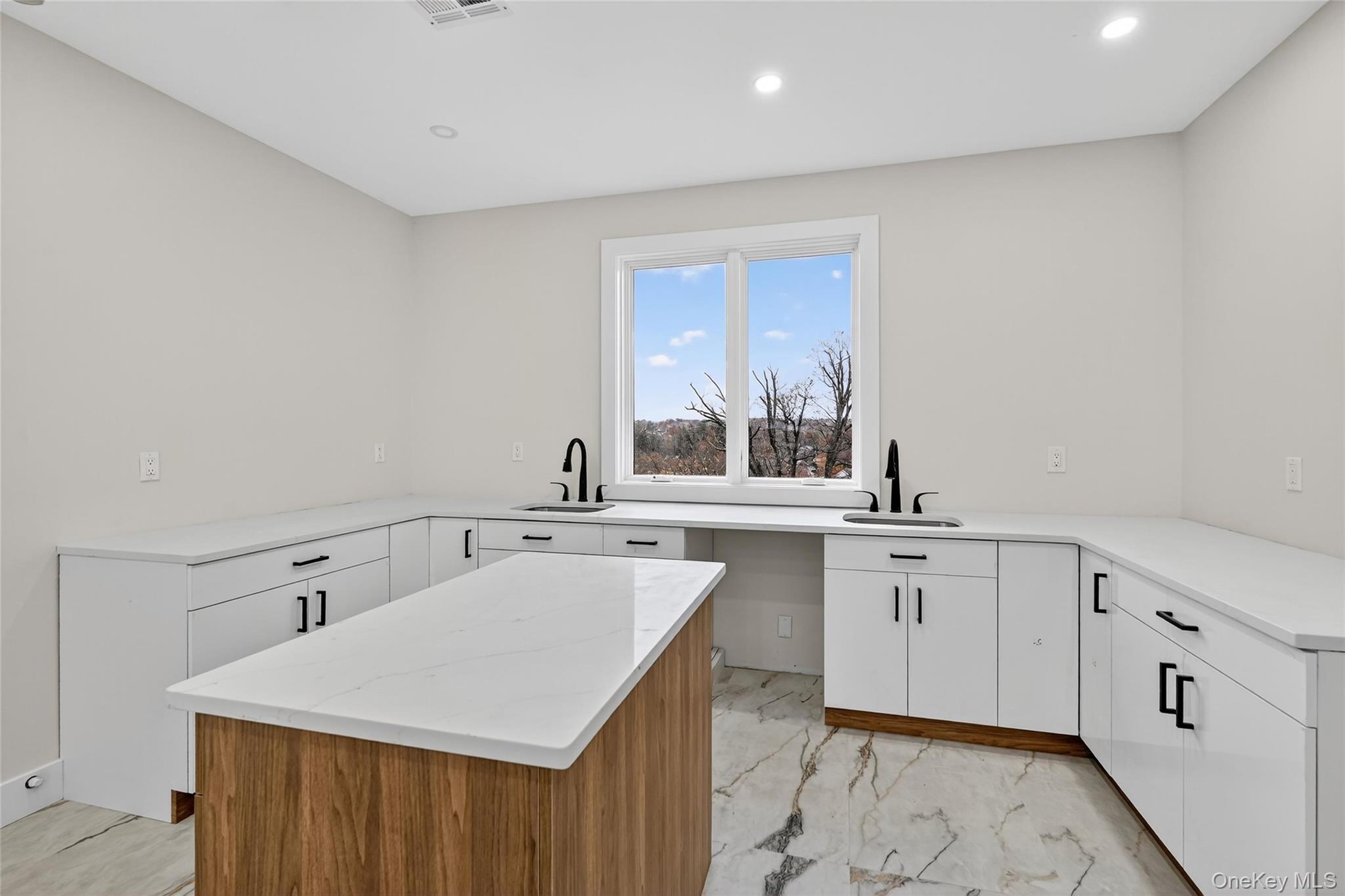 6 Milla Lane Spring Valley, NY 10977 - Photo 12 of 49 a kitchen with sink cabinets and window