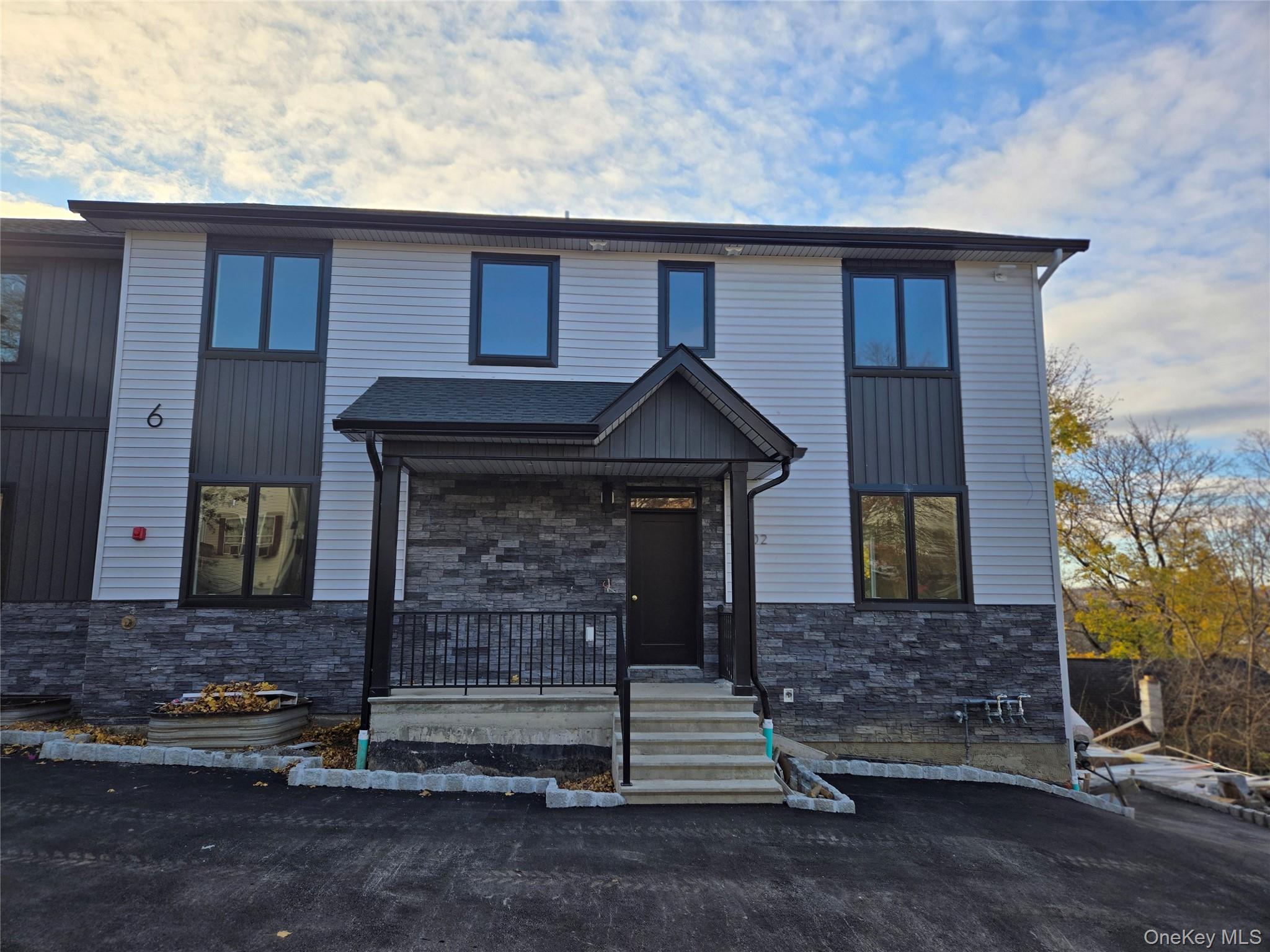 6 Milla Lane Spring Valley, NY 10977 - Photo 2 of 49 a front view of a house with a yard