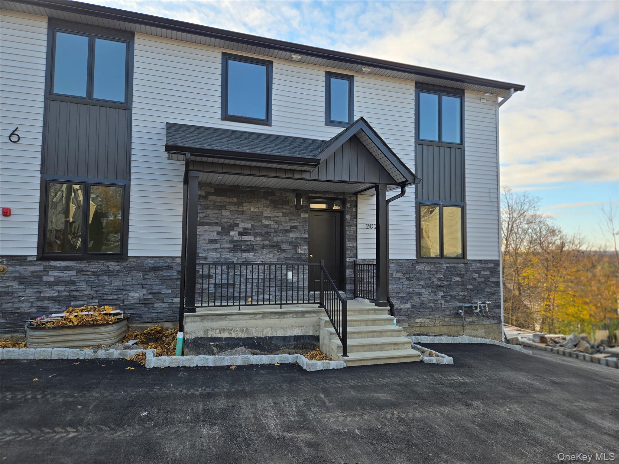 6 Milla Lane Spring Valley, NY 10977 - Photo 3 of 49 a front view of a house with parking space