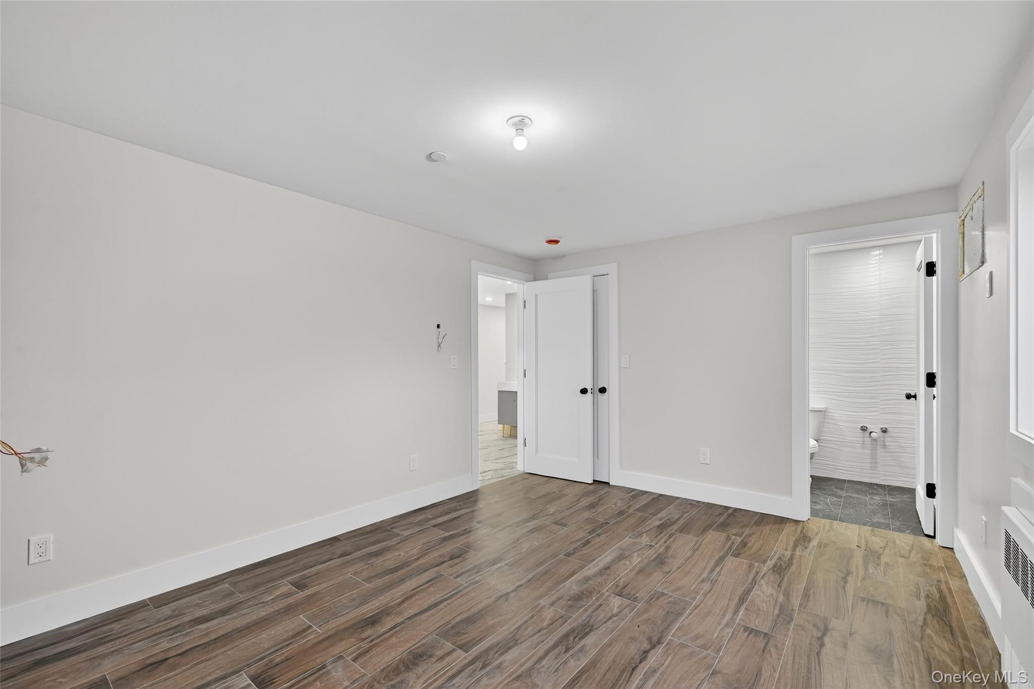 6 Milla Lane Spring Valley, NY 10977 - Photo 44 of 49 a view of a room with wooden floor