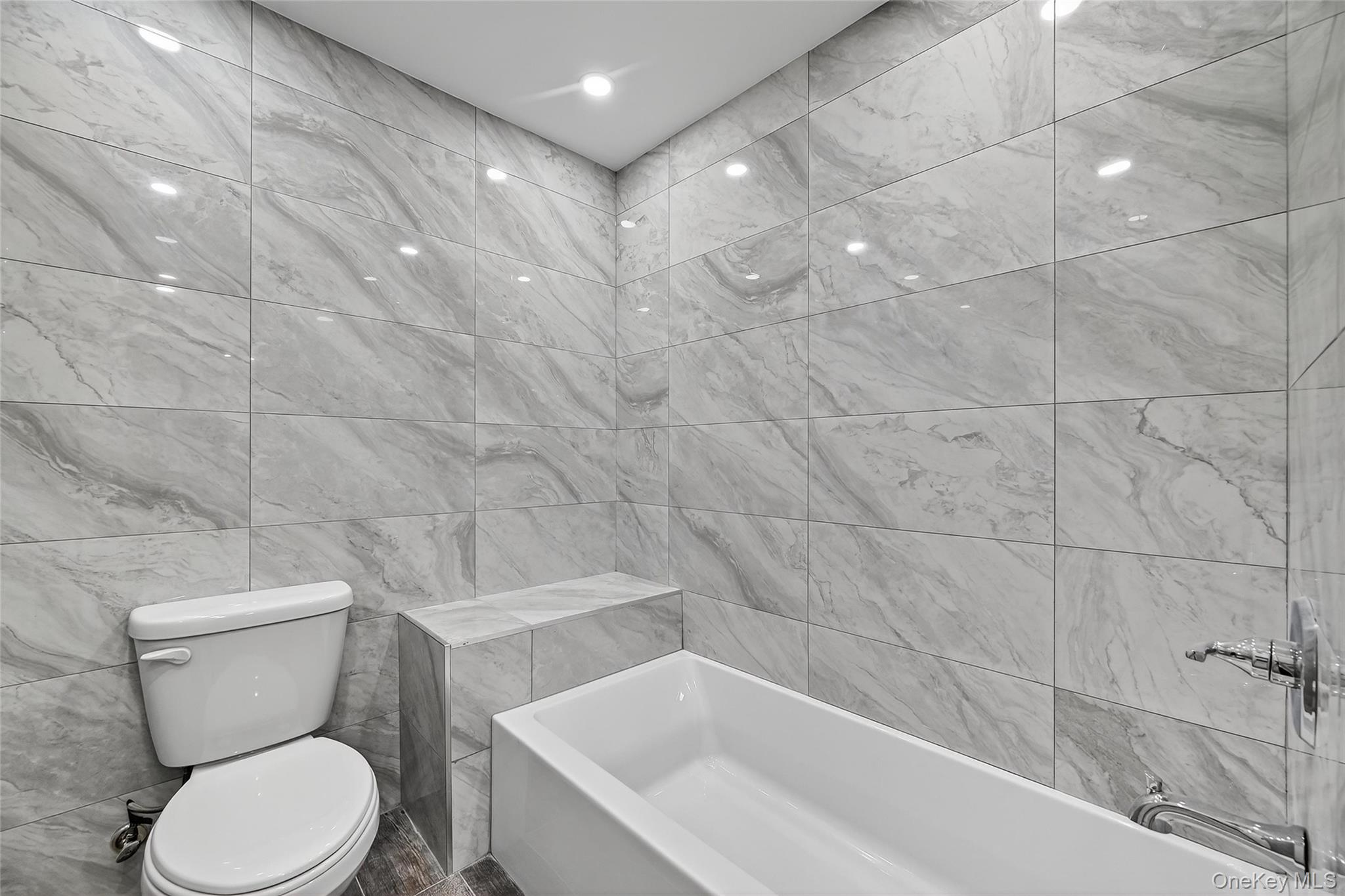 6 Milla Lane Spring Valley, NY 10977 - Photo 47 of 49 a white toilet sitting next to a bath tub