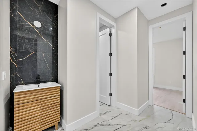 a bathroom with a shower and a sink