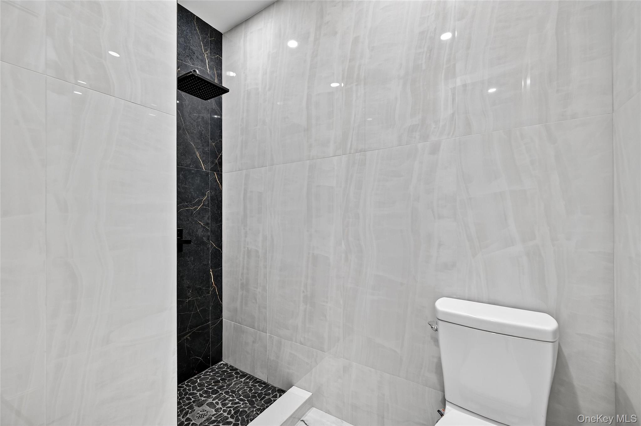 6 Milla Lane Spring Valley, NY 10977 - Photo 7 of 49 a bathroom with a shower and a toilet