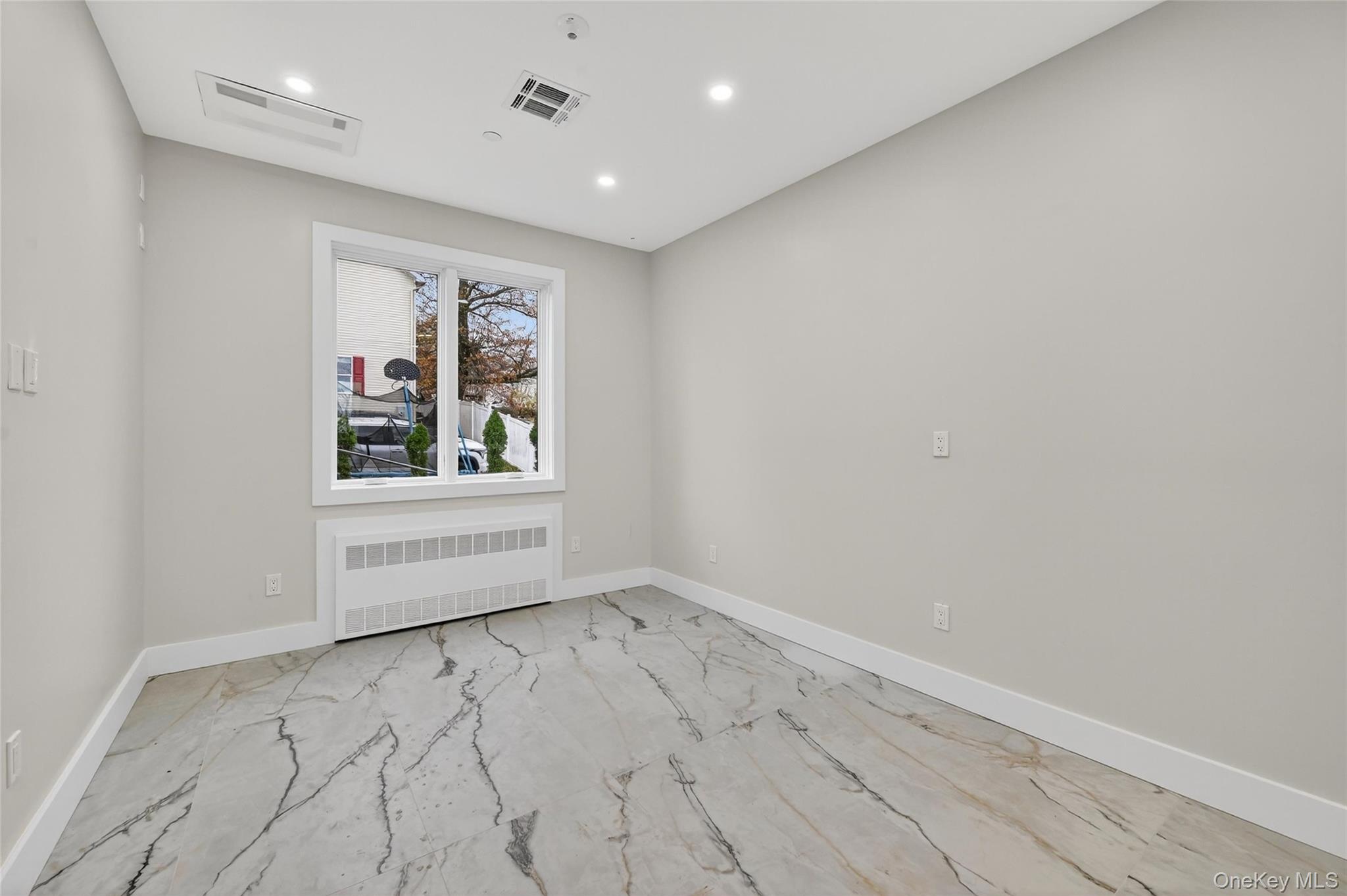 6 Milla Lane Spring Valley, NY 10977 - Photo 10 of 49 an empty room with windows