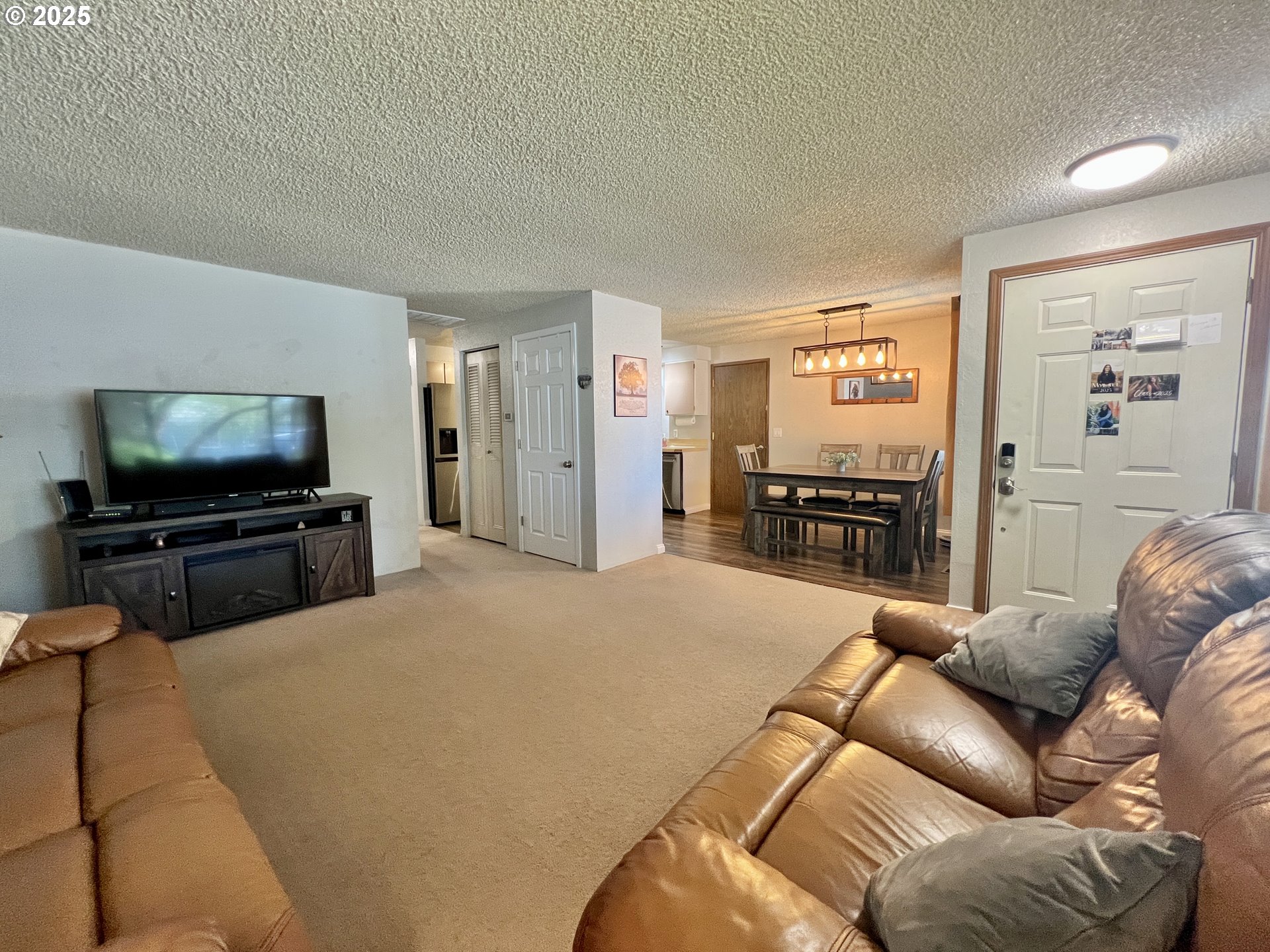 160 Heather Drive Stanfield, OR 97875 - Photo 11 of 21 a living room with furniture and a flat screen tv