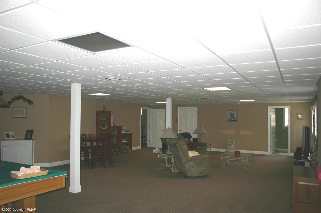 2189 Spruce Cabin Road Cresco, PA 18326 - Photo 13 of 13 a lobby with furniture and a mirror