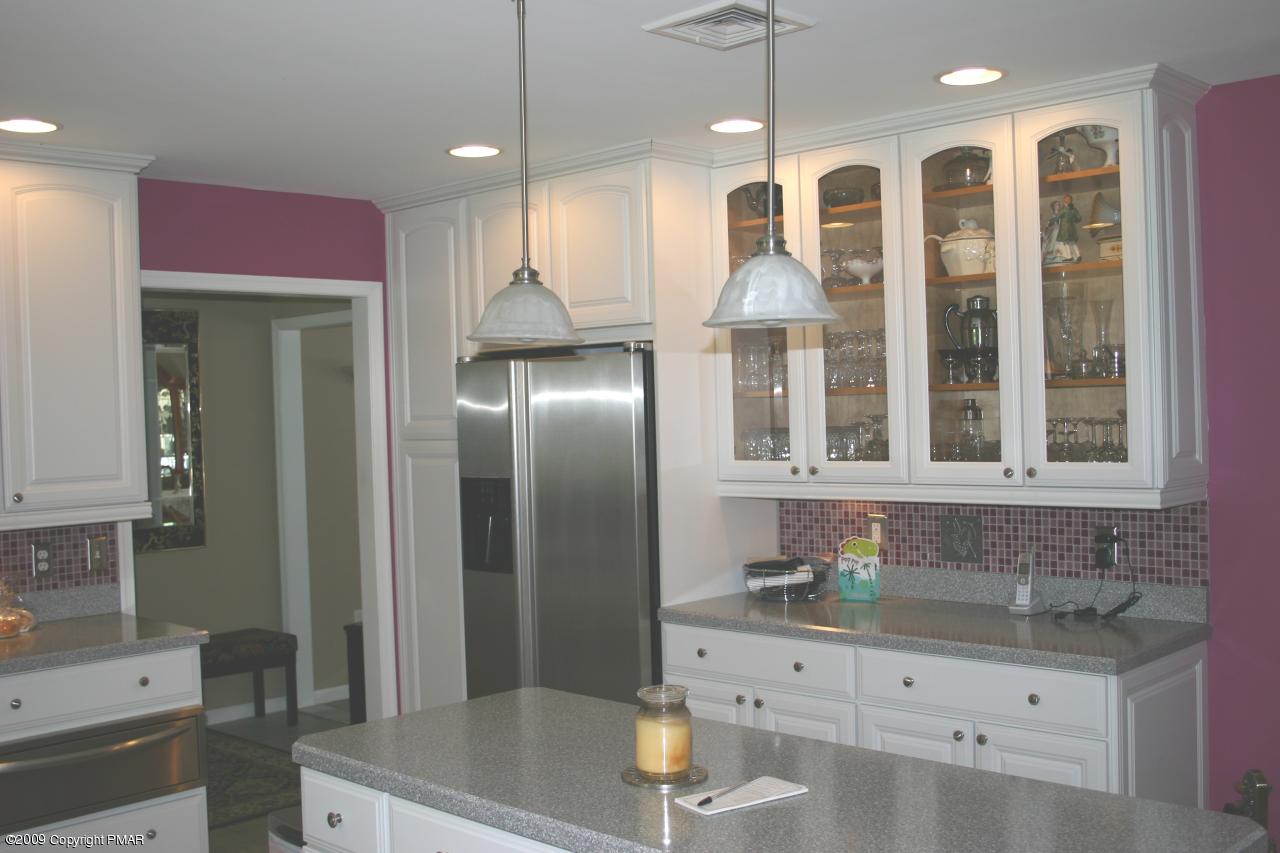 2189 Spruce Cabin Road Cresco, PA 18326 - Photo 4 of 13 a bathroom with a granite countertop sink a mirror and shower