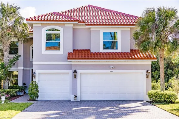 a front view of a house with a garage